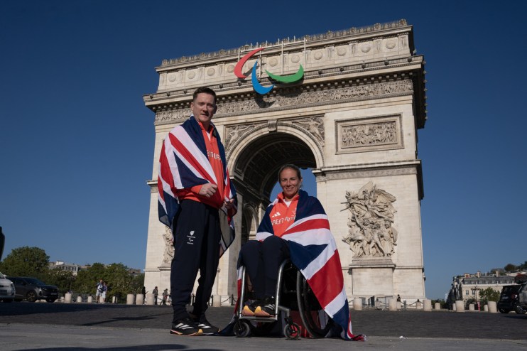 image of Paralympics GB para athletes Terry Bywater and Lucy Shuker outside Paris's Arc de Triomphe