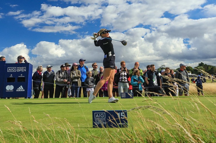 A golf player tees off on the 15th hole at the Women's British Open