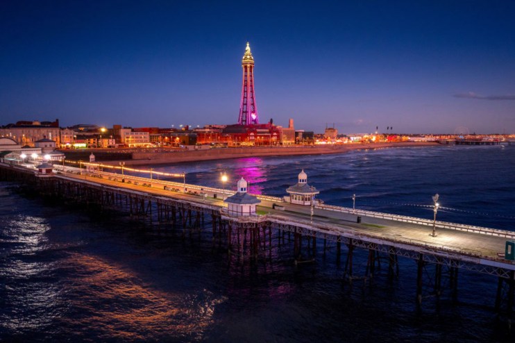 An aerial view of Blackpool Tower, North Pier and the promenade at night. (Photo by Christopher Furlong/Getty Images)