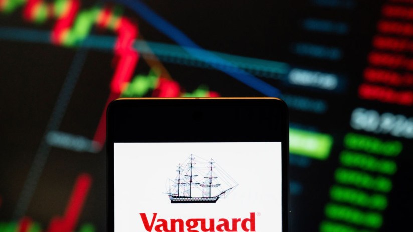 Vanguard logo seen displayed on a smartphone with a graph in the background. (Photo Illustration by Budrul Chukrut/SOPA Images/LightRocket via Getty Images)