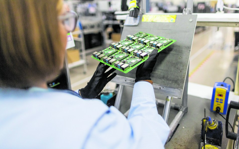 An employee performs quality control checks on Raspberry Pi personal computers on the production line at the Sony UK Technology Centre in Pencoed, UK, . Photographer: Chris Ratcliffe/Bloomberg via Getty Images