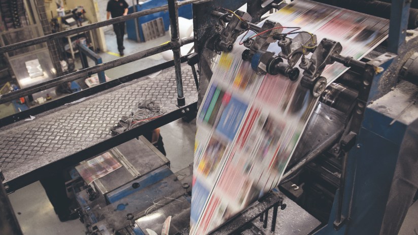 The press gets up to speed at the beginning of a print run (Photo by Leon Neal/Getty Images)