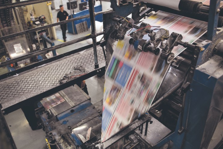 The press gets up to speed at the beginning of a print run (Photo by Leon Neal/Getty Images)