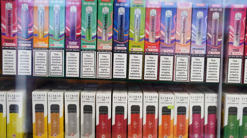 Imperial Brands vape products displayed with declining cigarette sales chart in a business news context