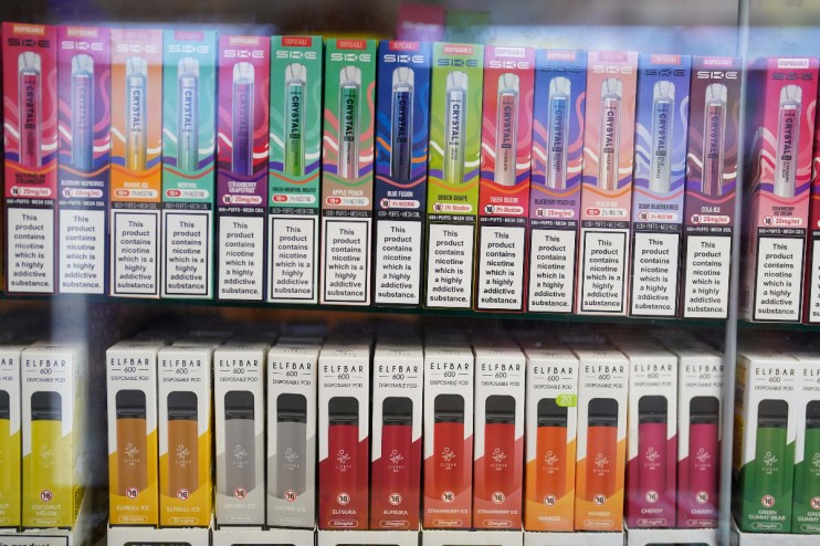 Imperial Brands vape products displayed with declining cigarette sales chart in a business news context