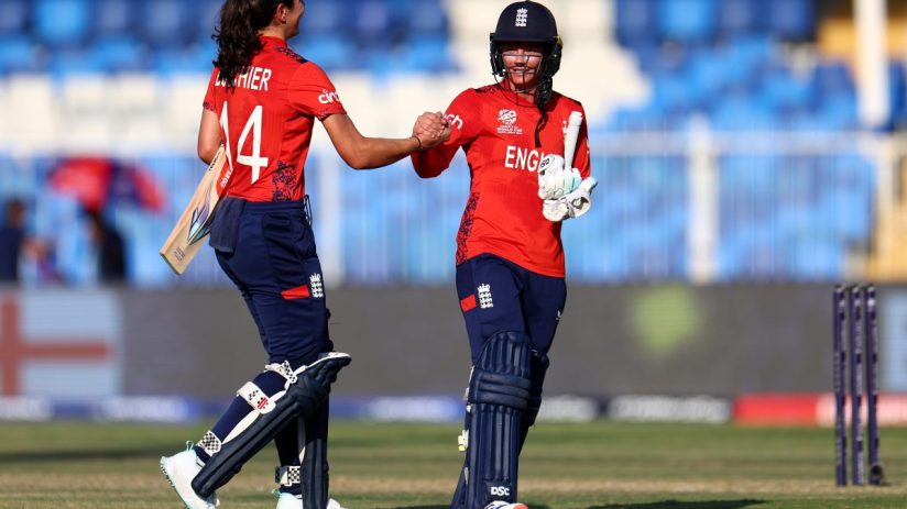 England thrashed Scotland in the Women's T20 Cricket World Cup to move top of their group and remain unbeaten.