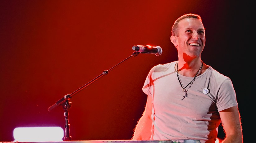 Coldplay concert packed with fans as ticket prices soar on resale markets, highlighting 2025 touting issues.