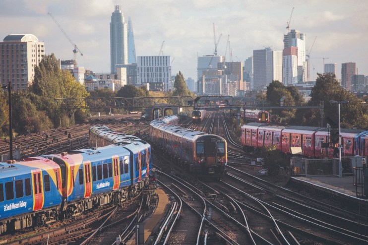 SWR was previously owned by FirstGroup and MTR Corporation, but is now the responsibility of DfT (Department for Transport) Operator. (A South Western train arrives at Clapham Junction. Photo by Jack Taylor/Getty Images)