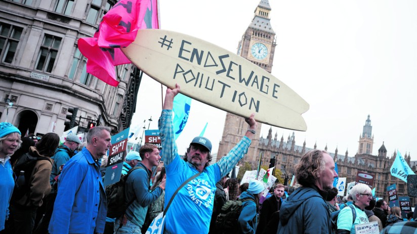 Campaigners protest against the water industry outside the Houses of Parliament