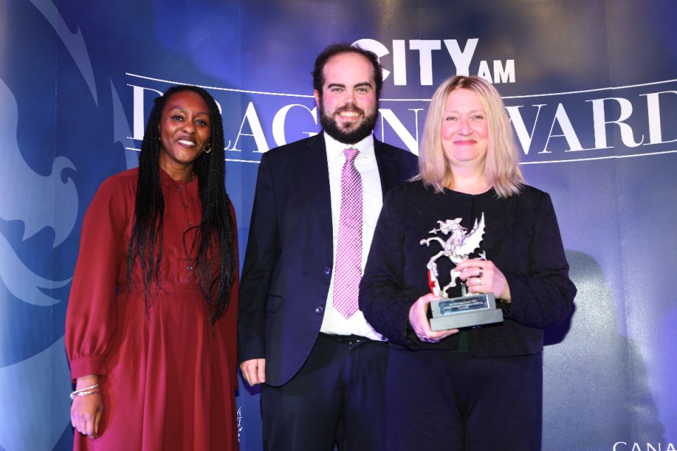 Carolyn Pepper (right) partner at Reed Smith presented with the award by the Canary Wharf Group's Associate Director of Sustainability Olivia Phillips (left). Morning Wire Dragon Awards 2024 at Mansion House. (Credit: Gretel Ensignia) 