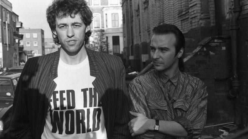 Bob Geldof and Midge Ure pictured outside SARM Studios in Notting Hill, London, during the recording of the Band Aid single 'Do They Know It's Christmas?', part of the Feed The World campaign, raising money for famine-stricken Ethiopia, on November 25, 1984. (Photo by Larry Ellis/Express Newspapers/Getty Images)