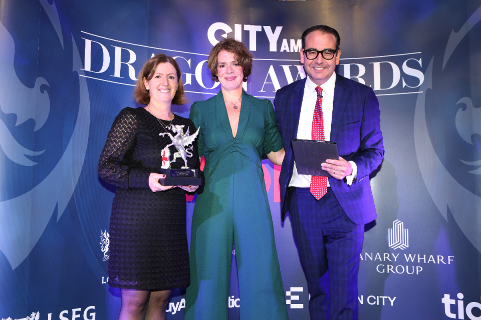 Elvira Lautenschlager, Chief of Staff and CIO, UBS, (left) accepts the award from Streets Consulting's Sarah Durrani and Oli Barrett. Morning Wire Dragon Awards 2024 at Mansion House. (Credit: Gretel Ensignia) 