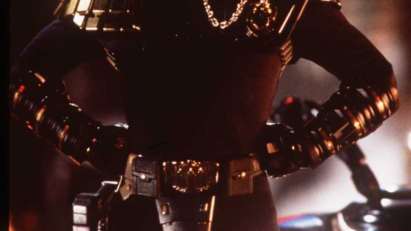 Judge Dredd with festive backdrop, illustrating the blend of British holiday joy and dystopian themes in Christmas specials