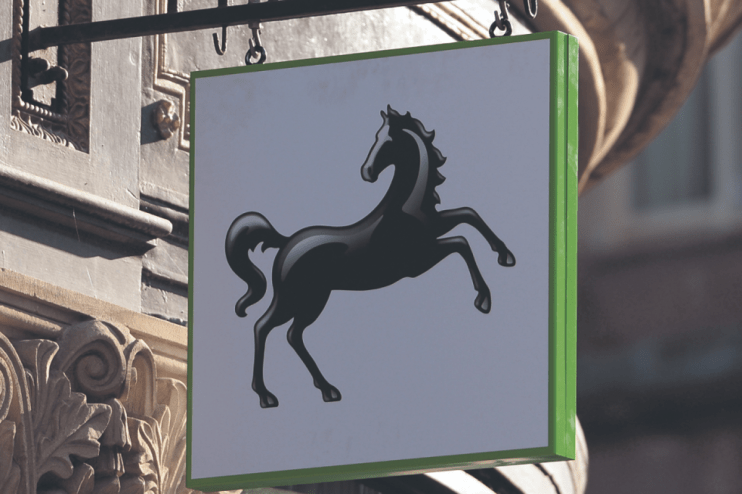 Lloyds Bank exterior with falling stock prices as shares drop on FTSE 100 amid banking sector fears
