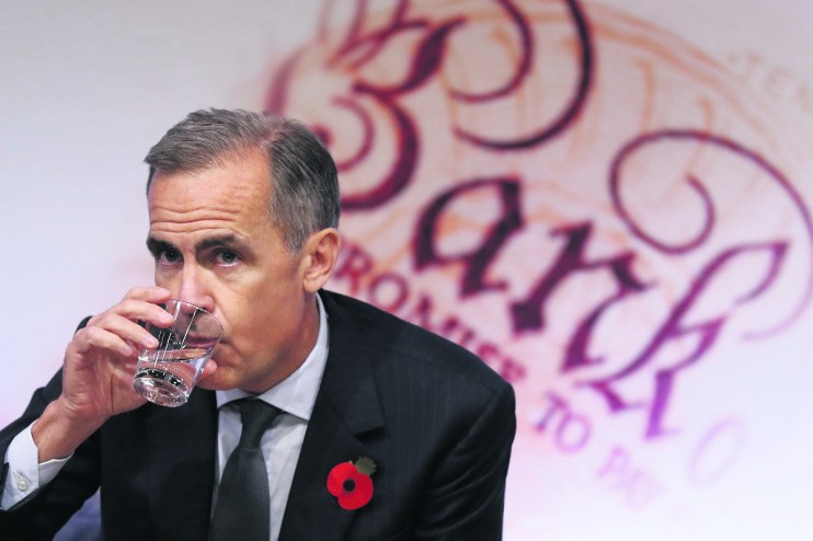 Former governor of the Bank of England, Mark Carney, takes a drink during the quarterly Inflation Report press conference at The Bank of England in London on November 3, 2016.(/ AFP / POOL / Kirsty Wigglesworth (Photo credit should read KIRSTY WIGGLESWORTH/AFP/Getty Images)