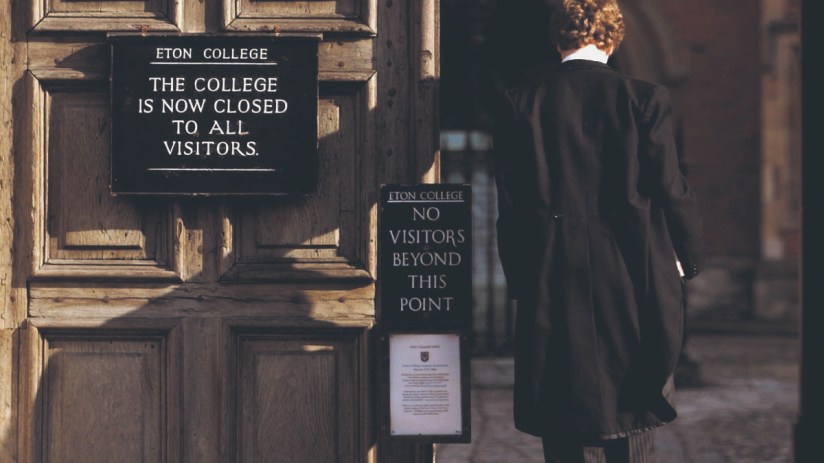 Pupil at Eton College hurries between lessons (Photo by Graeme Robertson/Getty Images).