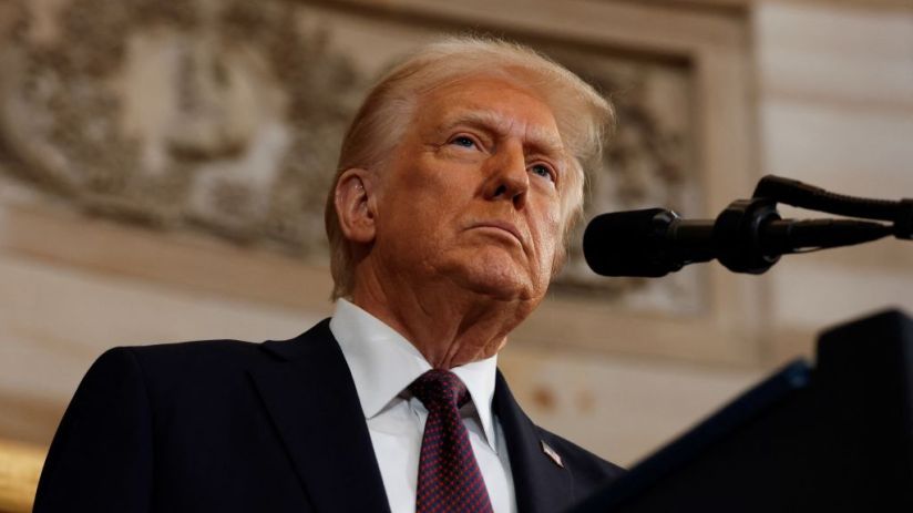 Donald Trump has told businesses they should make their products in the US, or face paying tariffs, while speaking at Davos.