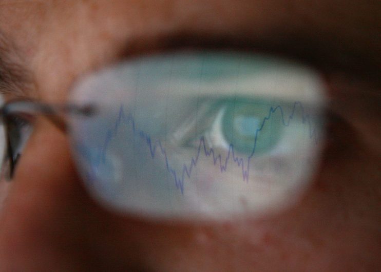 LONDON - OCTOBER 07: In this photo illustration, a graph is reflected representing the 12 month decline of the FTSE 100 share index on October 7, 2008 in London. Financial markets are still suffering large losses as the global banking crisis continued. (Photo by Peter Macdiarmid/Getty Images)