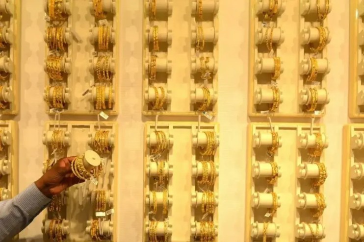 Gold jewelry displayed in Indian market as gold price hits record $5,097 amid Trump tariff turmoil and investor demand