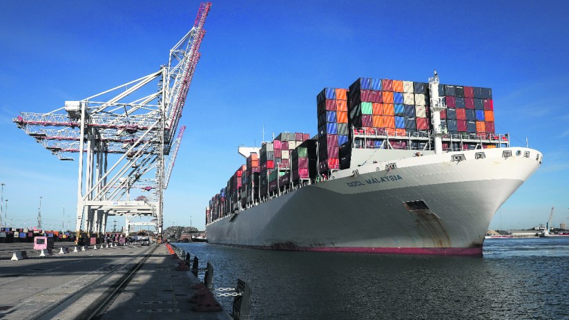 The Orient Overseas Container Line's (OOCL) Malaysia container ship, docks next to ship-to-shore cranes after arriving at the container terminal operated by DP World Ltd., at the Port of Southampton. Photographer: Simon Dawson/Bloomberg via Getty Images