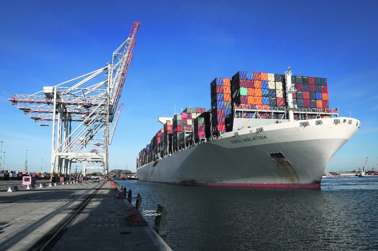 The Orient Overseas Container Line's (OOCL) Malaysia container ship, docks next to ship-to-shore cranes after arriving at the container terminal operated by DP World Ltd., at the Port of Southampton. Photographer: Simon Dawson/Bloomberg via Getty Images