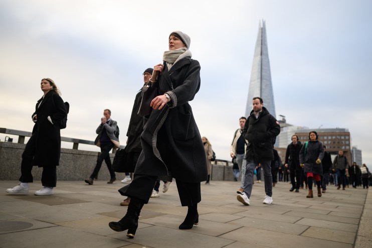 LONDON, UNITED KINGDOM - JANUARY 31: The Shard is seen on the horizon as commuters cross London Bridge during the morning rush hour on January 31, 2023 in London, United Kingdom. The IMF reports that the UK economy will contract by 0.6% in 2023, as opposed to the previous prediction it might grow, and will perform worse than many other advanced economies, including Russia.The cost of living continues to hit households with grocery inflation for the first four weeks of 2023 rising to 16.7% which would add a further &pound;788 per year to family food bills. (Photo by Leon Neal/Getty Images)