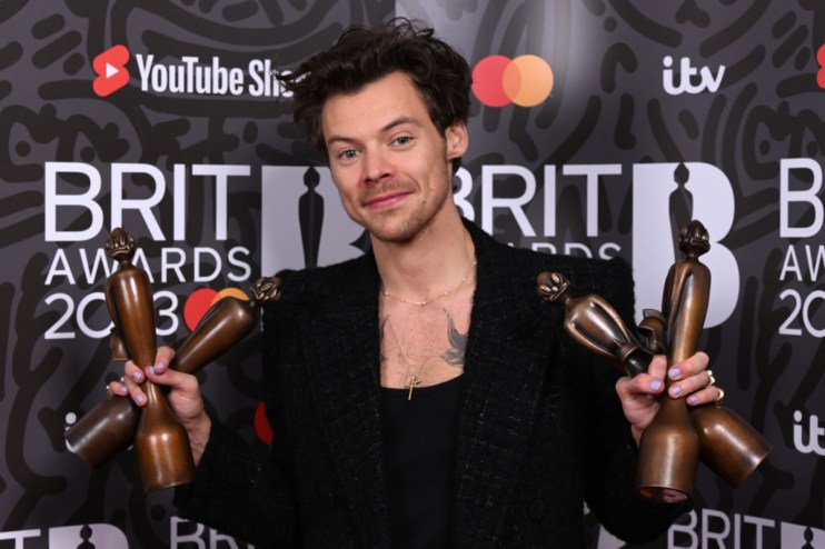 Harry Styles poses with the awards for British Pop/R&B Act, British Artist of the Year, Song of the Year and Album of the Year during The BRIT Awards 2023 at The O2 Arena. (Photo by Jeff Spicer/Getty Images)