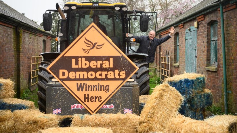 BERKHAMSTED, ENGLAND - MARCH 29: Leader of the Liberal Democrat Party Ed Davey poses for photos after driving a tractor through a pile of hay bales to promote the launch of the local election campaign on March 29, 2023 in Berkhamsted, England. The Liberal Democrats will campaign on rural issues and health to try and secure council seats at the local elections being held across the UK on May 4th. (Photo by Leon Neal/Getty Images)