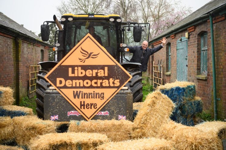 BERKHAMSTED, ENGLAND - MARCH 29: Leader of the Liberal Democrat Party Ed Davey poses for photos after driving a tractor through a pile of hay bales to promote the launch of the local election campaign on March 29, 2023 in Berkhamsted, England. The Liberal Democrats will campaign on rural issues and health to try and secure council seats at the local elections being held across the UK on May 4th. (Photo by Leon Neal/Getty Images)