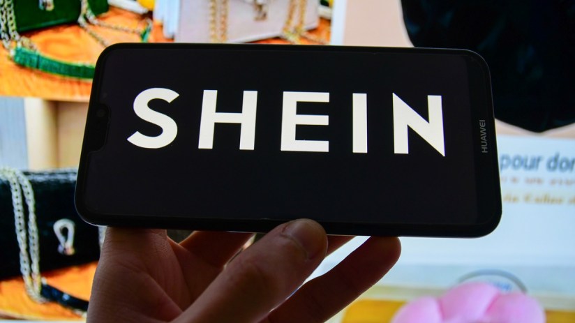 A photo illustration of the Shein company logo, a Chinese-founded online fashion retailer for adults and children (Photo Illustration by Romain Doucelin/SOPA Images/LightRocket via Getty Images)