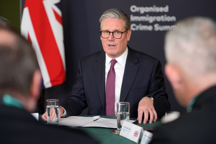 Prime Minister Sir Keir Starmer leads a roundtable discussion at the Organised Immigration Crime Summit. Photo: PA