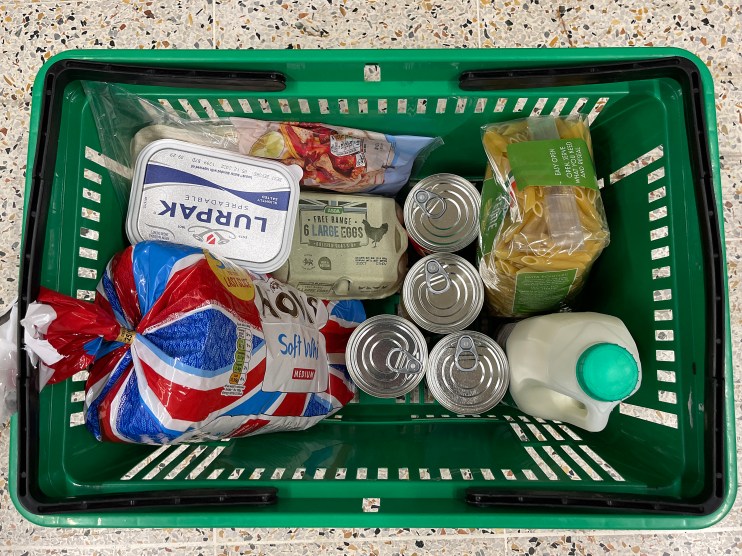 MANCHESTER, UNITED KINGDOM - OCTOBER 19: An Asda shopping basket containing groceries on October 19, 2022 in Manchester, United Kingdom. The Office for National Statistics (ONS) said the consumer prices index (CPI) measure rose from an annual rate of 9.9% in August to match the recent 40-year high of 10.1% seen in July. The largest contributing factor being the rise in food costs. (Photo by Christopher Furlong/Getty Images)