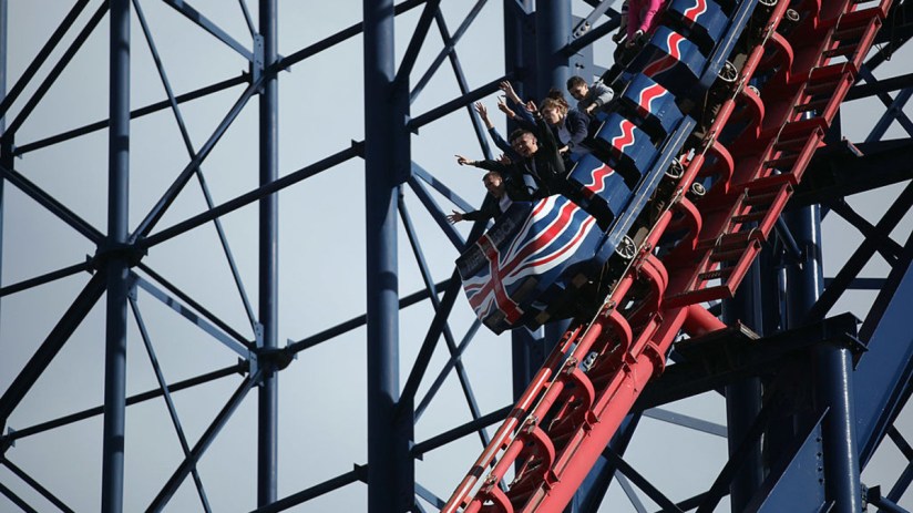 People ride a Rollercoaster at Blackpool Pleasure Beach. (Photo by Dan Kitwood/Getty Images)
