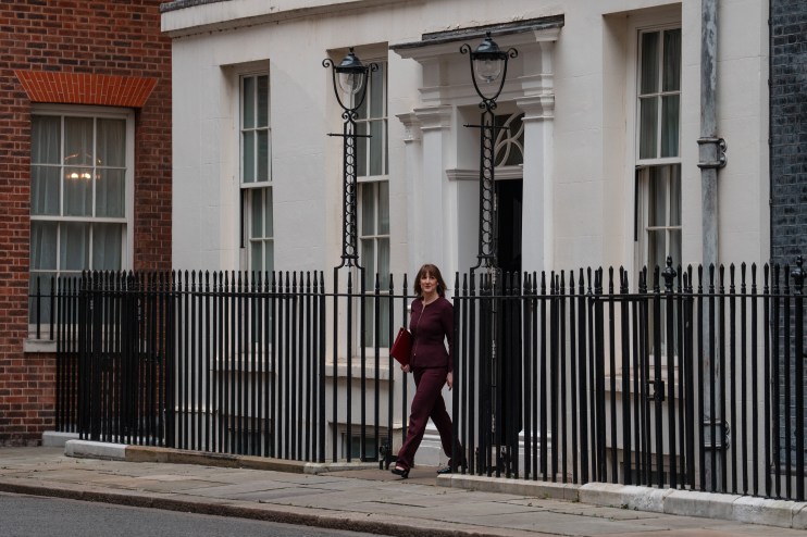 LONDON, ENGLAND - MARCH 26: Britain's Chancellor of the Exchequer, Rachel Reeves, leaves 11, Downing Street to deliver her Spring Statement to Parliament on March 26, 2025 in London, England. The Labour Chancellor delivers the Spring Statement against a bleak backdrop of a flatlining British economy with both inflation and government borrowing costs up, plus the looming prospect of export tariffs from Donald Trump's US Government. (Photo by Carl Court/Getty Images)