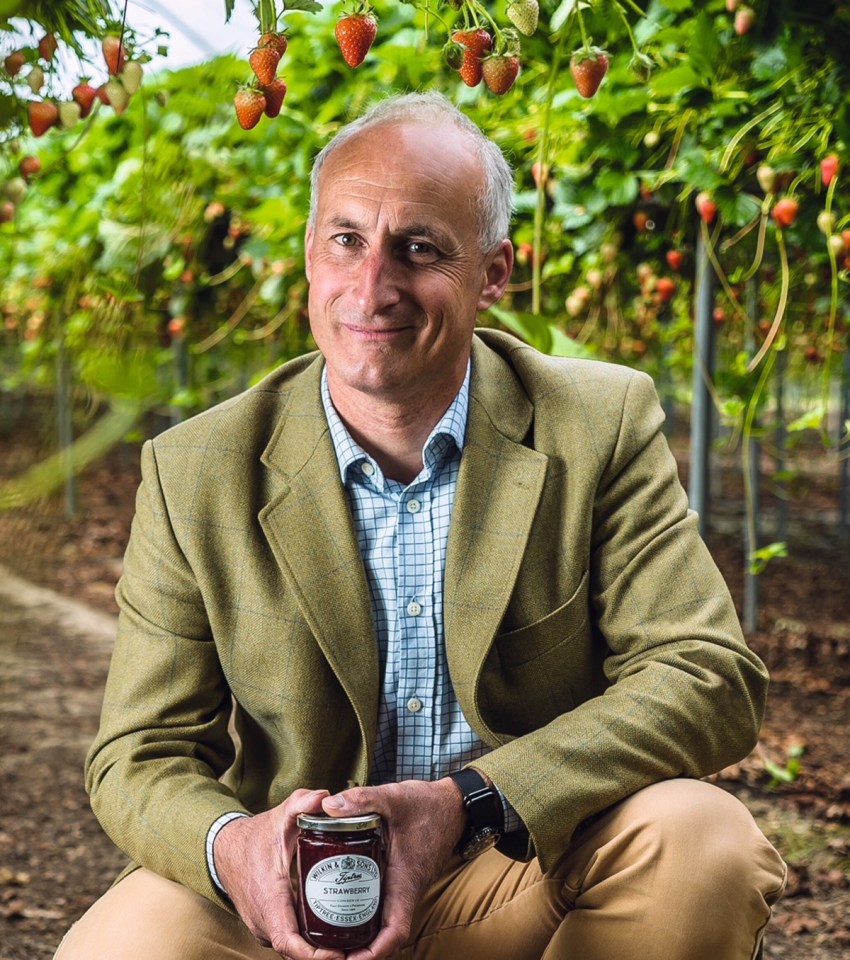image of a man holding a jam jar