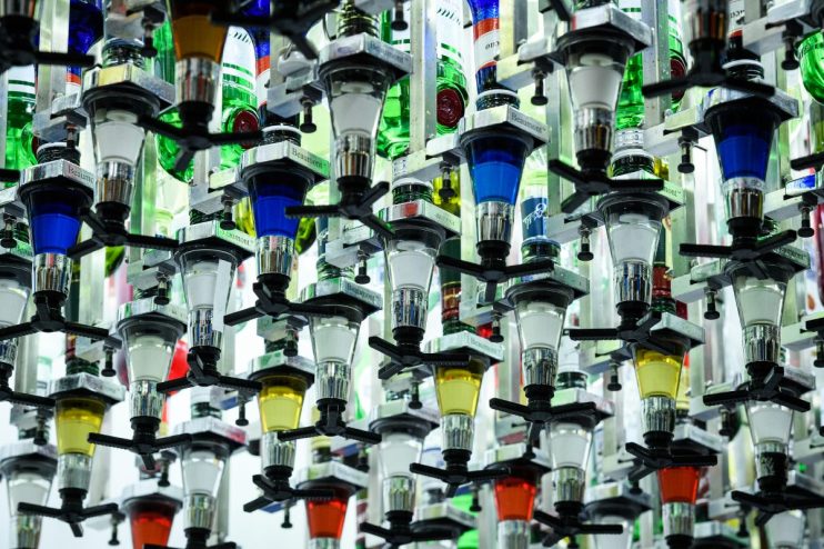 LONDON, ENGLAND - AUGUST 07: Bottles of alcoholic spirits are seen mounted above "Toni", an automated cocktail maker made by "Makr Shakr", during a press event to promote the "AI: More than Human" exhibition at the Barbican Centre on August 07, 2019 in London, England. Six bartenders were asked to mix certain cocktails in a bid to beat the robotic system in a taste-test challenge. The "AI: More than Human" exhibition takes a look at creative and scientific developments in artificial intelligence, and explores the evolution of the relationship between humans and technology. (Photo by Leon Neal/Getty Images)
