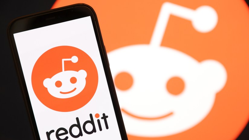 SAN ANSELMO, CALIFORNIA - DECEMBER 16: In this photo illustration, The Reddit logo is displayed on the screen of an iPhone on December 16, 2021 in San Anselmo, California. Reddit has confidentially filed paperwork for an initial public offering (IPO) with the Securities and Exchange Commission. (Photo Illustration by Justin Sullivan/Getty Images)