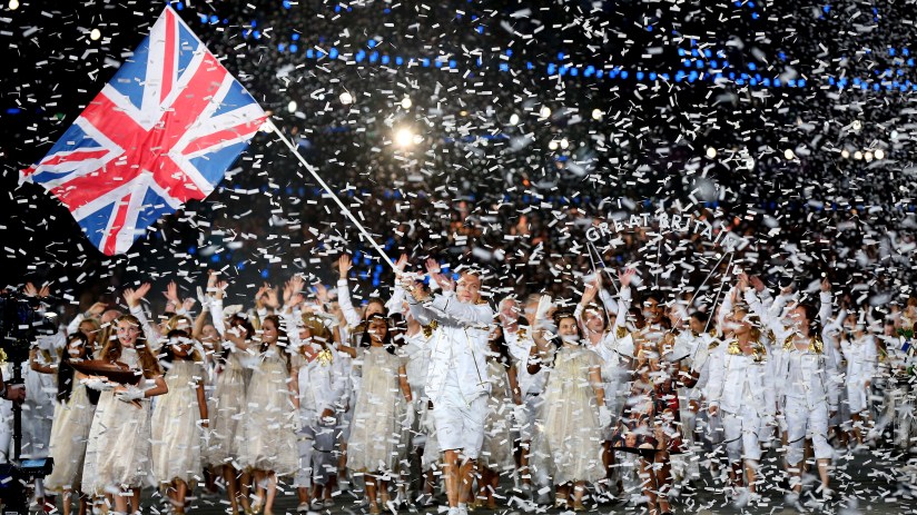 LONDON, ENGLAND - JULY 27: Sir Chris Hoy of the Great Britain Olympic cycling team carries his country's flag as he leads Great Britain into the stadium during the Opening Ceremony of the London 2012 Olympic Games at the Olympic Stadium on July 27, 2012 in London, England. (Photo by Cameron Spencer/Getty Images)