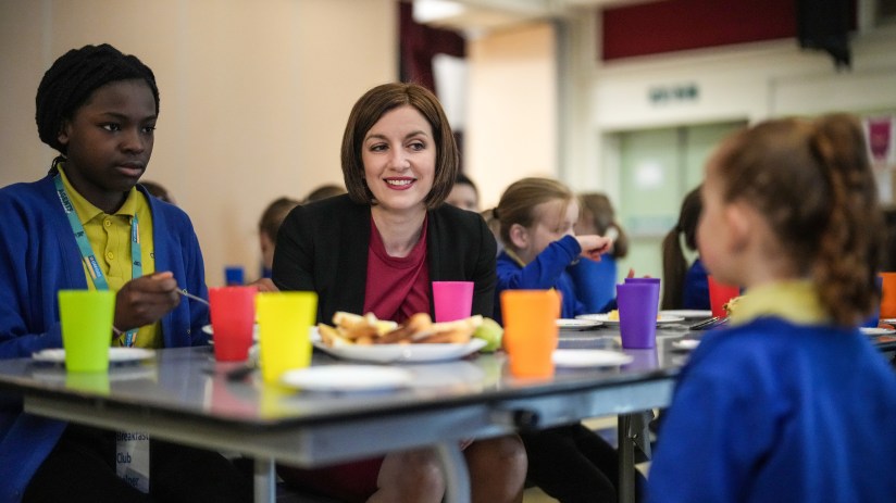 BURNLEY, ENGLAND - MARCH 22: Labour's Shadow Education Secretary Bridget Phillipson talks with children as they attend Cherry Fold Primary School's breakfast club on March 22, 2024 in Burnley, England. Labour's Shadow Education Secretary visited the breakfast program at Burnley's Cherry Fold Primary School and outlined Labour's plans to expand free breakfast initiatives to all schools in the UK. The Breakfast Club at Cherry Fold School is currently financed by the Greggs Foundation which gives schools the funds to provide nutritious food, helping 900 clubs across the UK feed over 62,000 children. (Photo by Christopher Furlong/Getty Images)