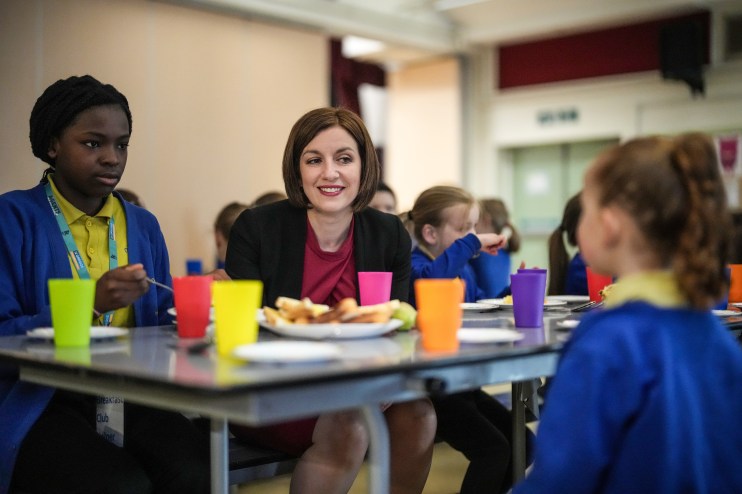 BURNLEY, ENGLAND - MARCH 22: Labour's Shadow Education Secretary Bridget Phillipson talks with children as they attend Cherry Fold Primary School's breakfast club on March 22, 2024 in Burnley, England. Labour's Shadow Education Secretary visited the breakfast program at Burnley's Cherry Fold Primary School and outlined Labour's plans to expand free breakfast initiatives to all schools in the UK. The Breakfast Club at Cherry Fold School is currently financed by the Greggs Foundation which gives schools the funds to provide nutritious food, helping 900 clubs across the UK feed over 62,000 children. (Photo by Christopher Furlong/Getty Images)