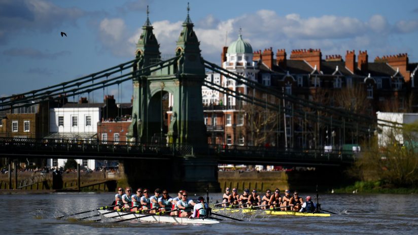 LONDON, ENGLAND - MARCH 30: A general view as Gemma King, Joanna Matthews, Iris Powell, Jenna Armstrong, Carina Graf, Carys Earl, Clare Hole, Megan Lee and Hannah Murphy of Cambridge University Boat Club compete against Lucy Edmunds, Ella Stadler, Tessa Haining, Claire Aitken, Sarah Marshall, Annie Sharp, Julia Lindsay, Annie Anezakis and Joe Gellett of Oxford University Boat Club as they approach Hammersmith Bridge during The Gemini Boat Race 2024 on March 30, 2024 in London, England. (Photo by Alex Davidson/Getty Images)