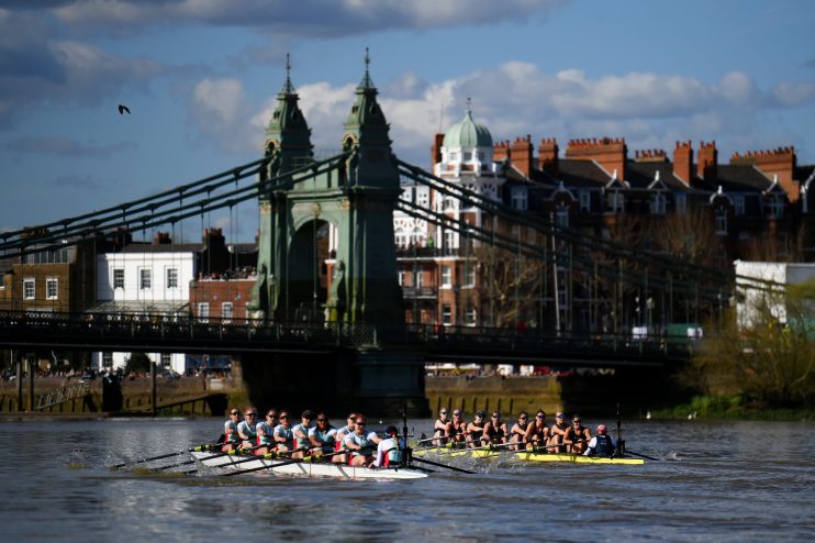 LONDON, ENGLAND - MARCH 30: A general view as Gemma King, Joanna Matthews, Iris Powell, Jenna Armstrong, Carina Graf, Carys Earl, Clare Hole, Megan Lee and Hannah Murphy of Cambridge University Boat Club compete against Lucy Edmunds, Ella Stadler, Tessa Haining, Claire Aitken, Sarah Marshall, Annie Sharp, Julia Lindsay, Annie Anezakis and Joe Gellett of Oxford University Boat Club as they approach Hammersmith Bridge during The Gemini Boat Race 2024 on March 30, 2024 in London, England. (Photo by Alex Davidson/Getty Images)
