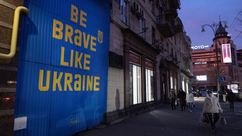 KYIV, UKRAINE - MARCH 05: Pedestrians walk past a sign supporting Ukraine in a downtown shopping area on March 5, 2025 in Kyiv, Ukraine. (Photo by Paula Bronstein / Getty Images)