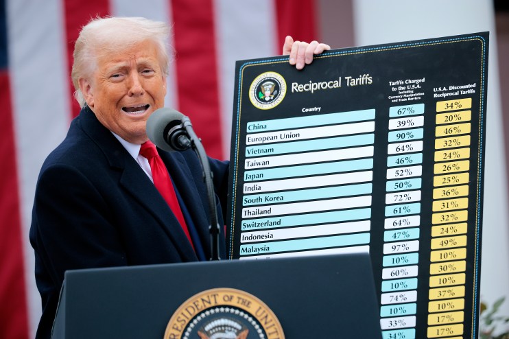 WASHINGTON, DC - APRIL 02: U.S. President Donald Trump holds up a chart while speaking during a &ldquo;Make America Wealthy Again&rdquo; trade announcement event in the Rose Garden at the White House on April 2, 2025 in Washington, DC. Touting the event as &ldquo;Liberation Day&rdquo;, Trump is expected to announce additional tariffs targeting goods imported to the U.S. (Photo by Chip Somodevilla/Getty Images)