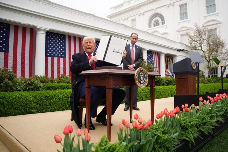 WASHINGTON, DC - APRIL 02: U.S. President Donald Trump displays a signed executive order imposing tariffs on imported goods during a &ldquo;Make America Wealthy Again&rdquo; trade announcement event in the Rose Garden at the White House on April 2, 2025 in Washington, DC. Touting the event as &ldquo;Liberation Day&rdquo;, Trump announced sweeping new tariffs targeting goods imported to the U.S. on countries including China, Japan and India. (Photo by Andrew Harnik/Getty Images)