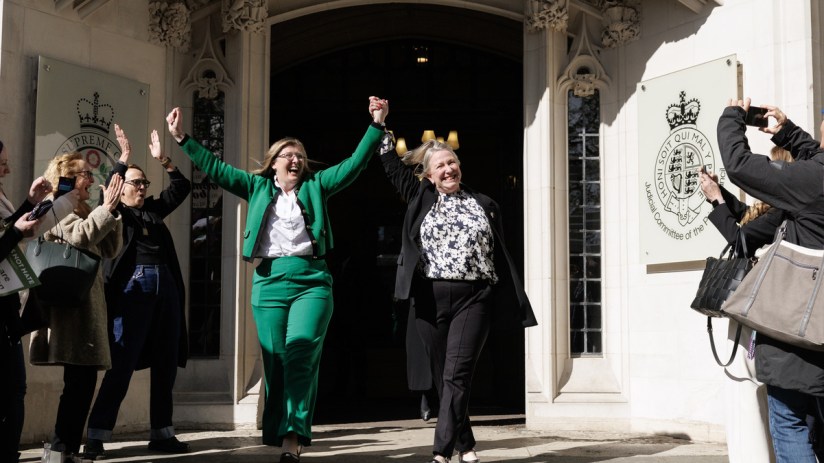 Susan Smith (L) and Marion Calder, directors of 'For Women Scotland' cheer as they leave the Supreme Court after it ruled that unanimously that "the terms 'woman' and 'sex' in the Equality Act 2010 refer to a biological woman and biological sex (Photo by Dan Kitwood/Getty Images)