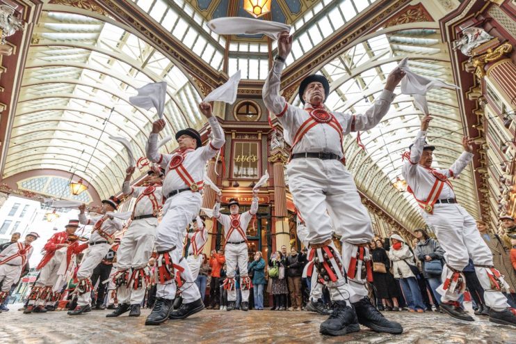 LONDON, ENGLAND - APRIL 23: The Ewell St Mary's Morris Men dance at Leadenhall Market on April 23, 2025 in London, England. City workers and tourists watch the Ewell St Mary's Morris Men performing in traditional costume complete with bells and handkerchiefs ahead of St George's Day, which falls next Monday instead of the usual April 23rd, due to the Easter period. (Photo by Dan Kitwood/Getty Images)