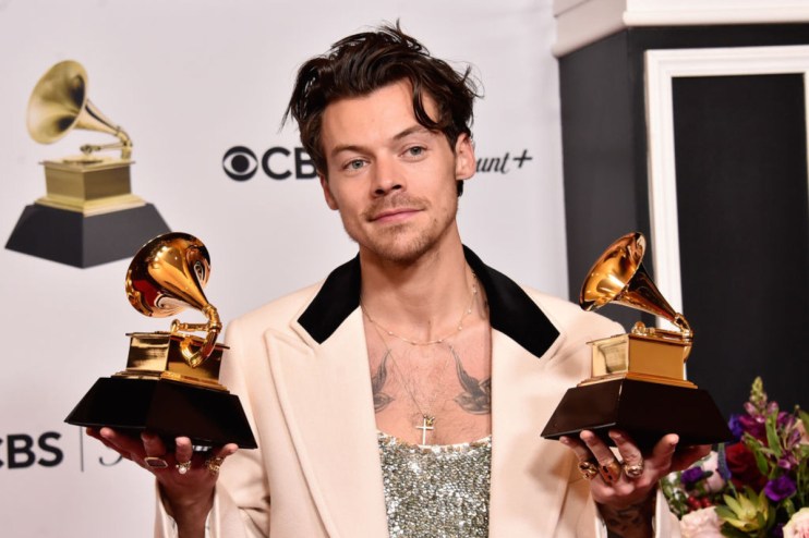 Harry Styles poses with the Best Pop Vocal Album Award and Album of the Year Award for Harry&rsquo;s House during the 65th Grammy Awards in February 2023. (Photo by Alberto E. Rodriguez/Getty Images for The Recording Academy)