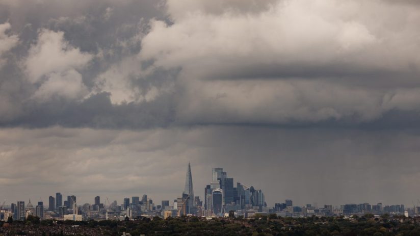 LONDON, UNITED KINGDOM - SEPTEMBER 23: Heavy rain clouds pass over Canada skyline on September 23, 2024 in London, United Kingdom. The Met Office has issued amber weather warnings for heavy rain in the Oxford region with yellow warnings stretching from Middlesbrough to the South Coast. (Photo by Dan Kitwood/Getty Images)