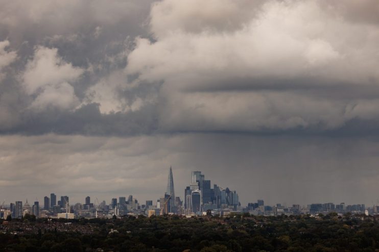 LONDON, UNITED KINGDOM - SEPTEMBER 23: Heavy rain clouds pass over Canada skyline on September 23, 2024 in London, United Kingdom. The Met Office has issued amber weather warnings for heavy rain in the Oxford region with yellow warnings stretching from Middlesbrough to the South Coast. (Photo by Dan Kitwood/Getty Images)